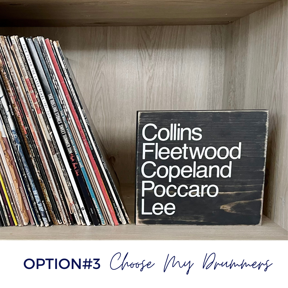 A black wood sign sits on a bookshelf next to a stack of vinyl records. The sign reads. "Collins Fleetwood Copeland Poccaro Lee". The image shows that this is Option #3, Choose My Drummers.