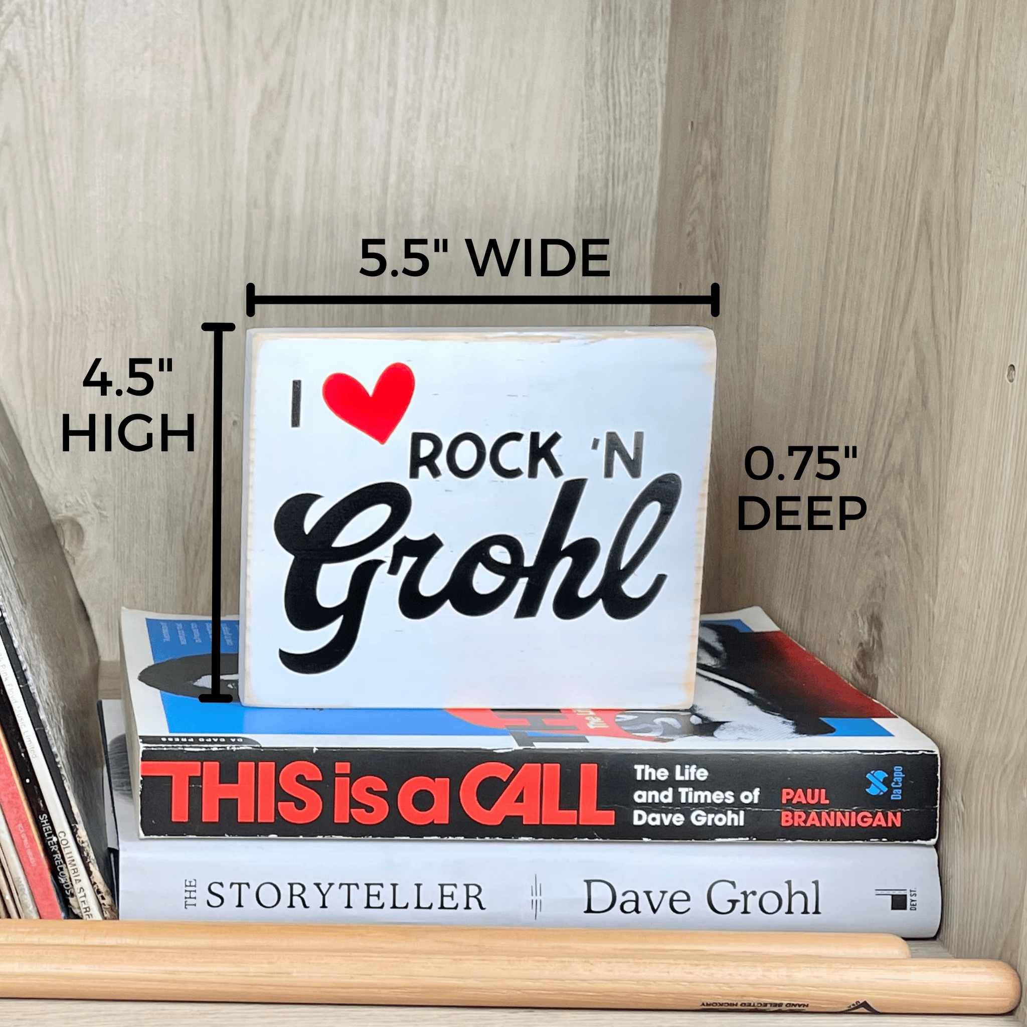 Shows the measurements of the Rock n' Grohl sign which are 5.5" wide, 4.5" high and 0.75" deep