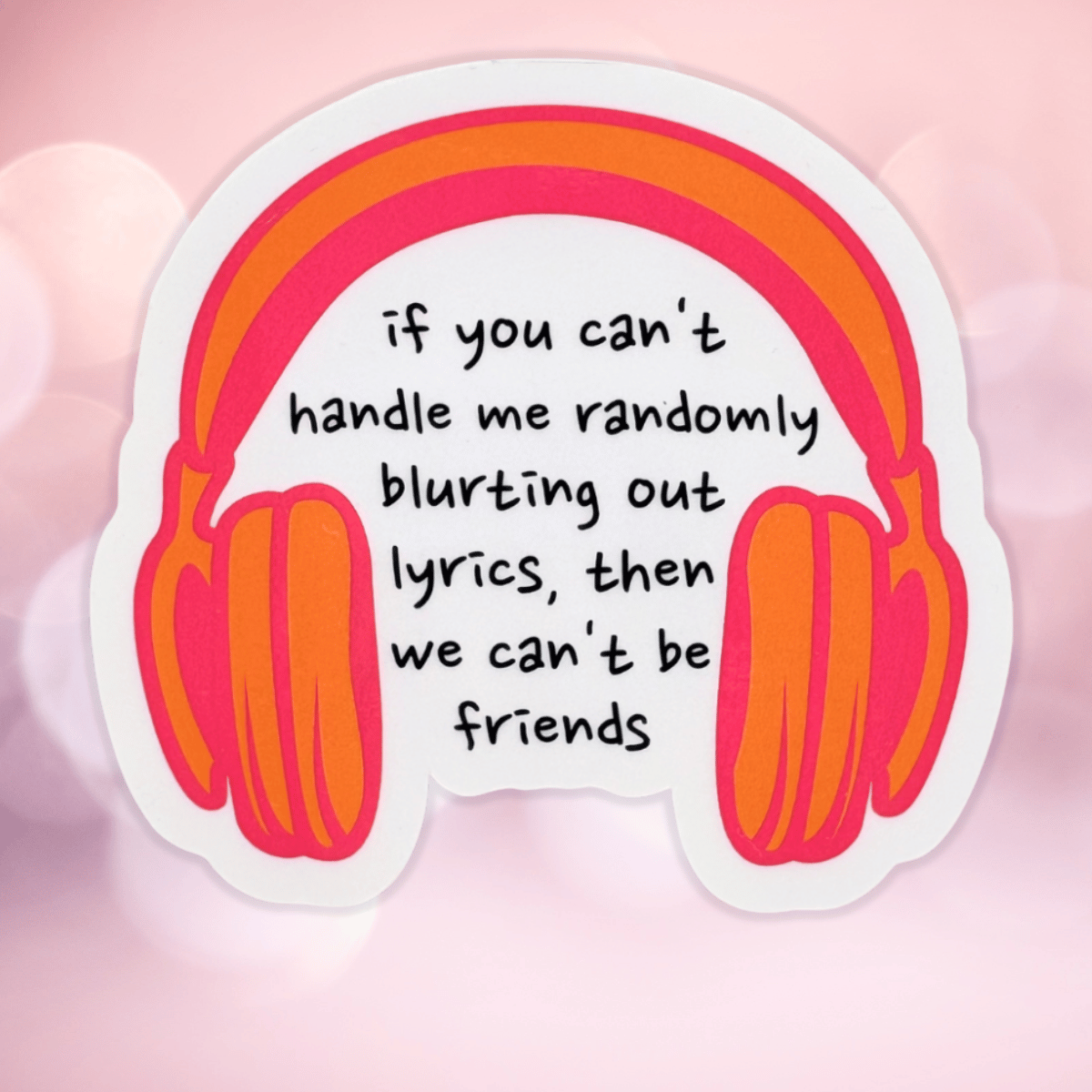 Sticker with headphones and text on a pink background