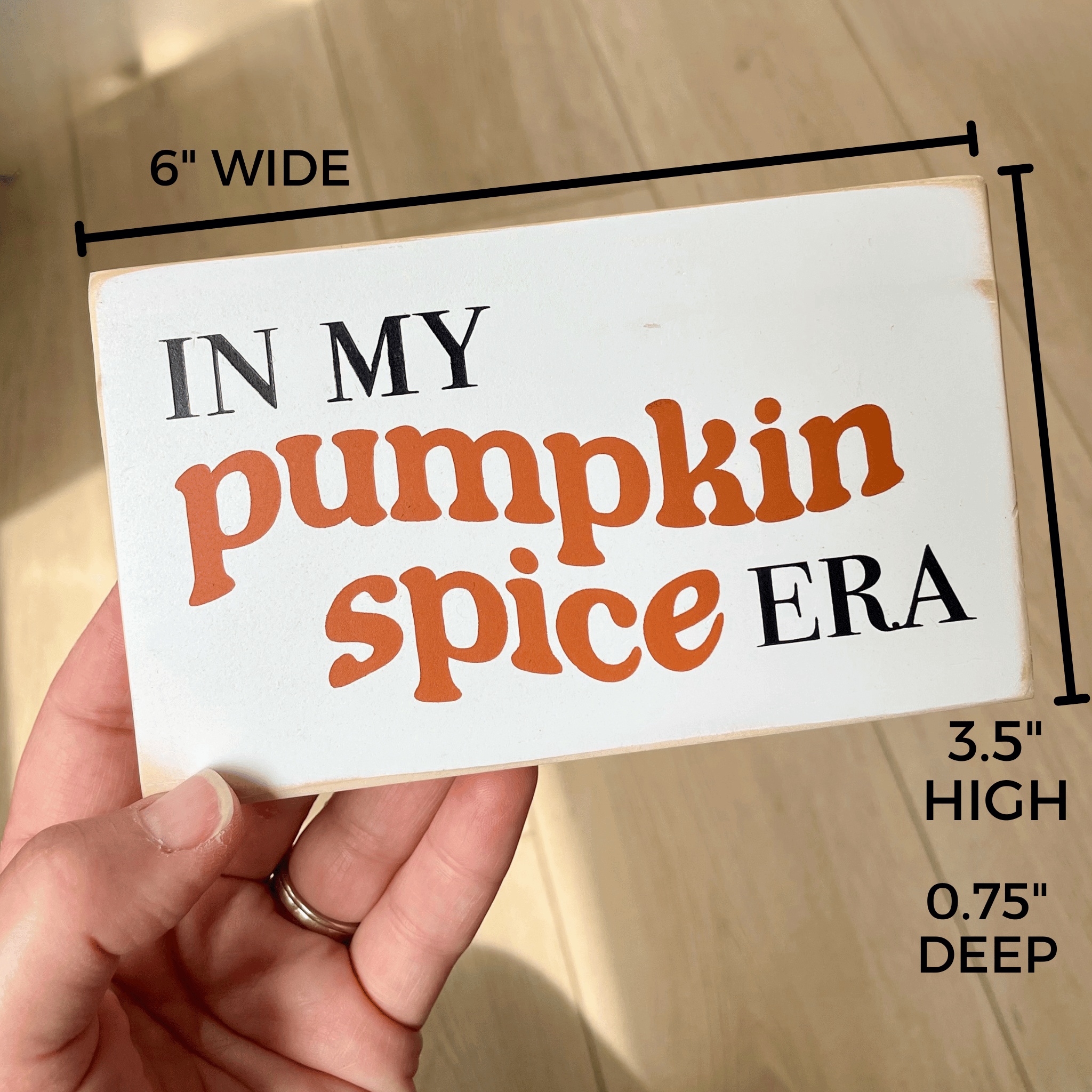 Shows the dimensions of the sign that reads "in my pumpkin spice era" which are 6" wide, 3.5" high and 0.75" deep