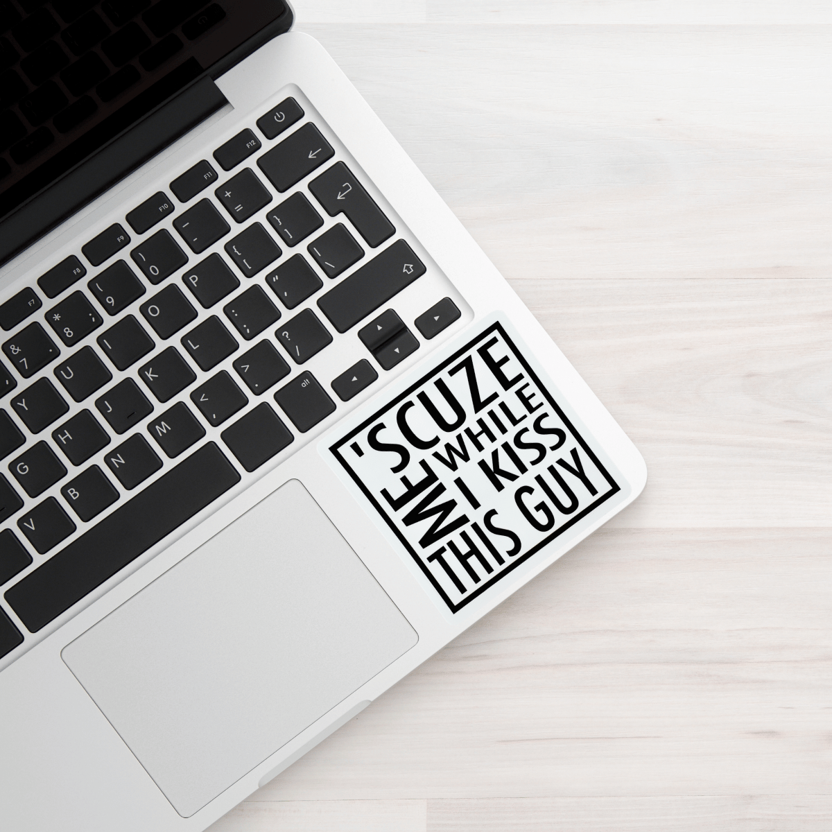 Laptop with a humorous sticker on the palm rest area