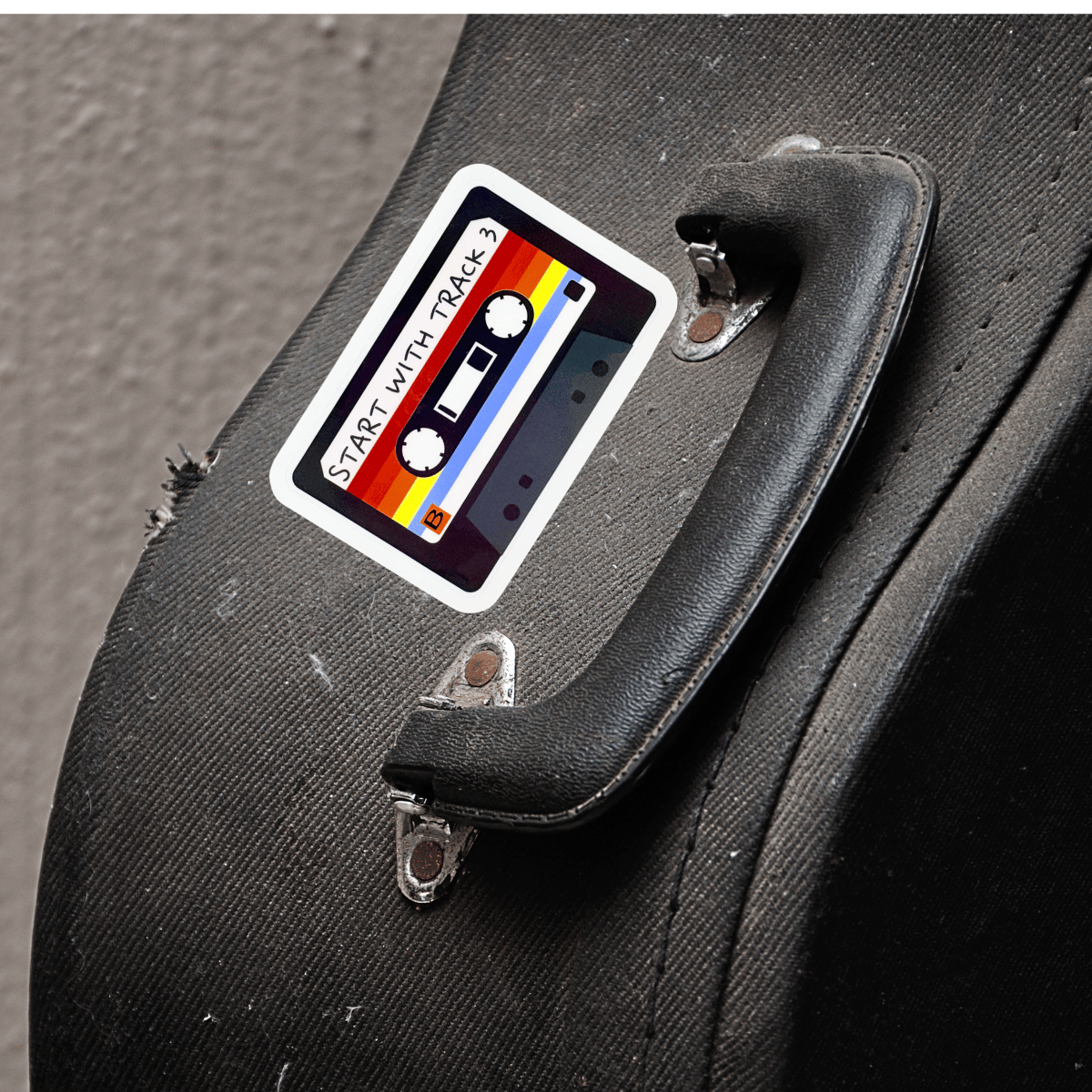 Cassette tape design sticker on a guitar case