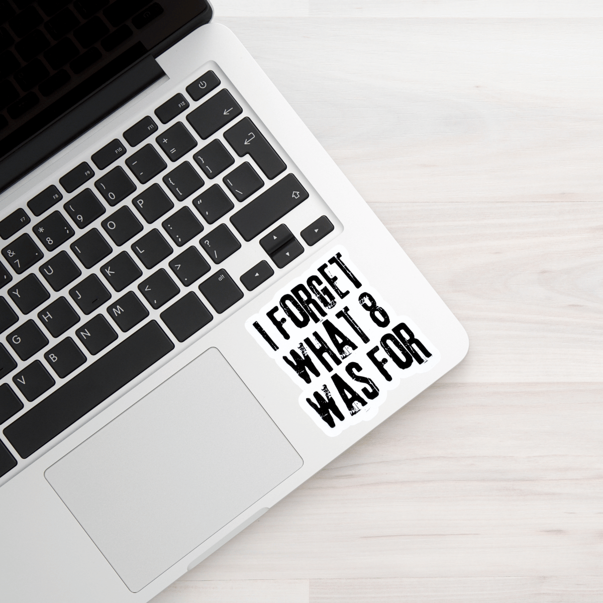 Laptop with a humorous sticker on the palm rest area