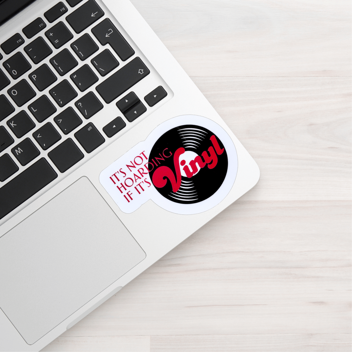 Vinyl record-themed sticker on a laptop