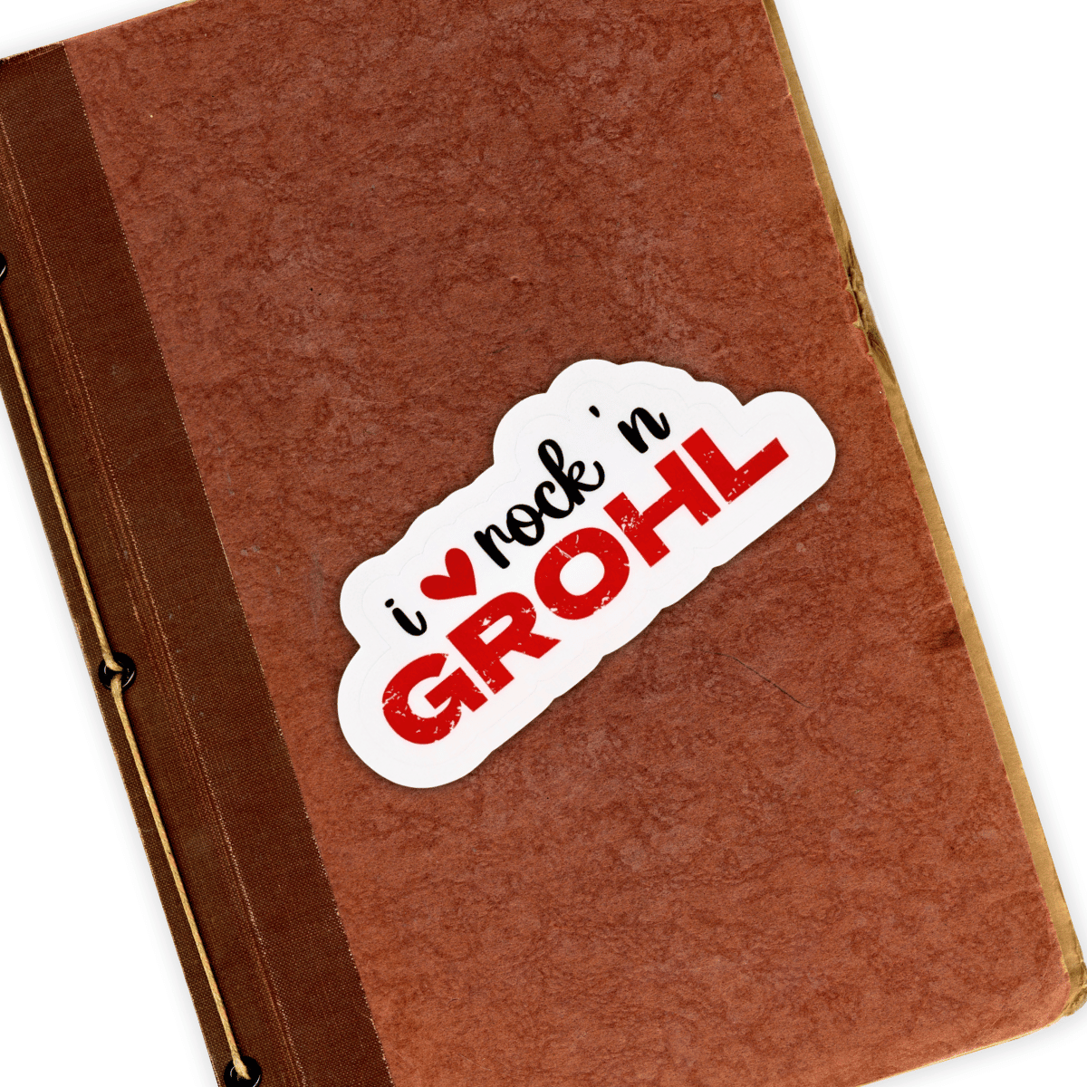 The "I love Rock n Grohl" sticker is on the cover of a brown tattered notebook