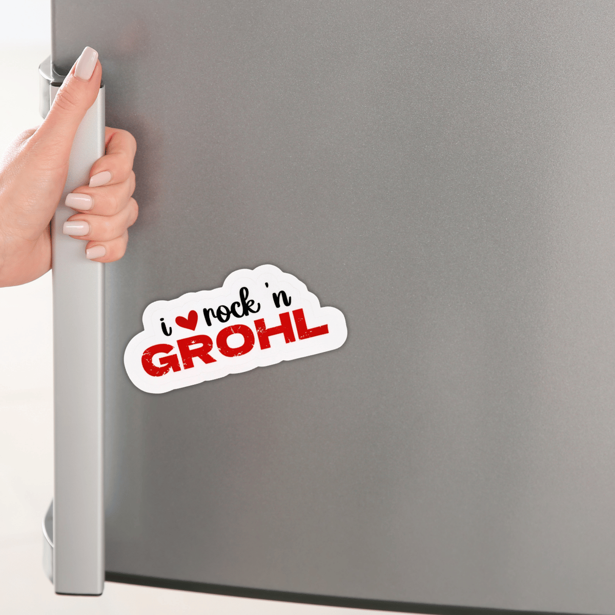 The "I love Rock n Grohl" sticker is on a gray mini-fridge.
