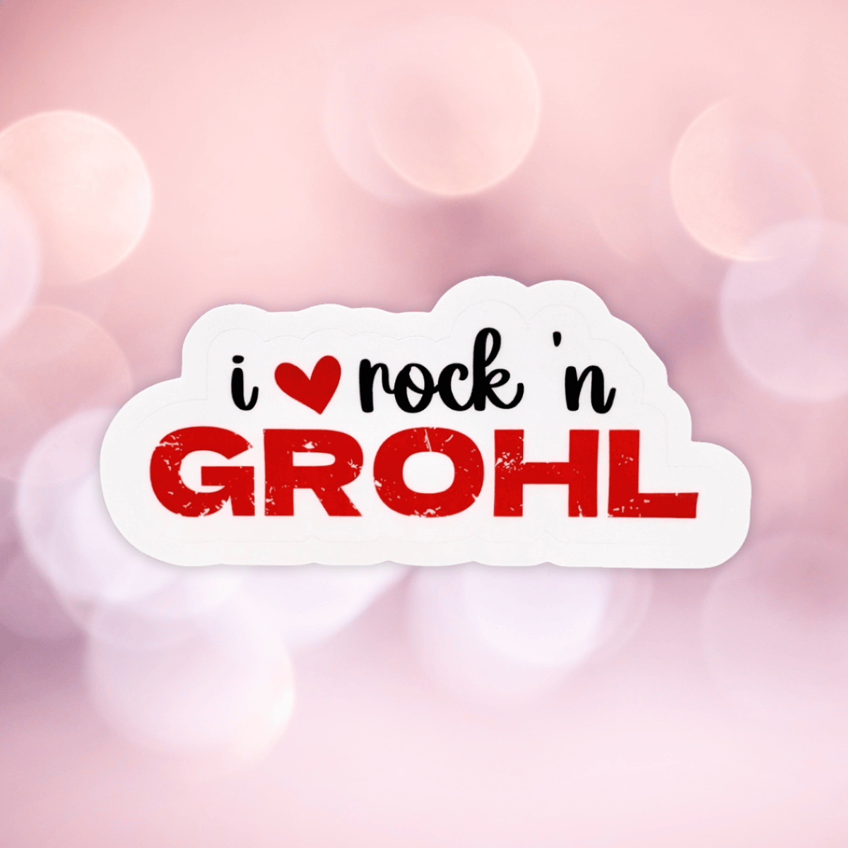 The "I love Rock n Grohl" sticker is on a pink, blurred background.